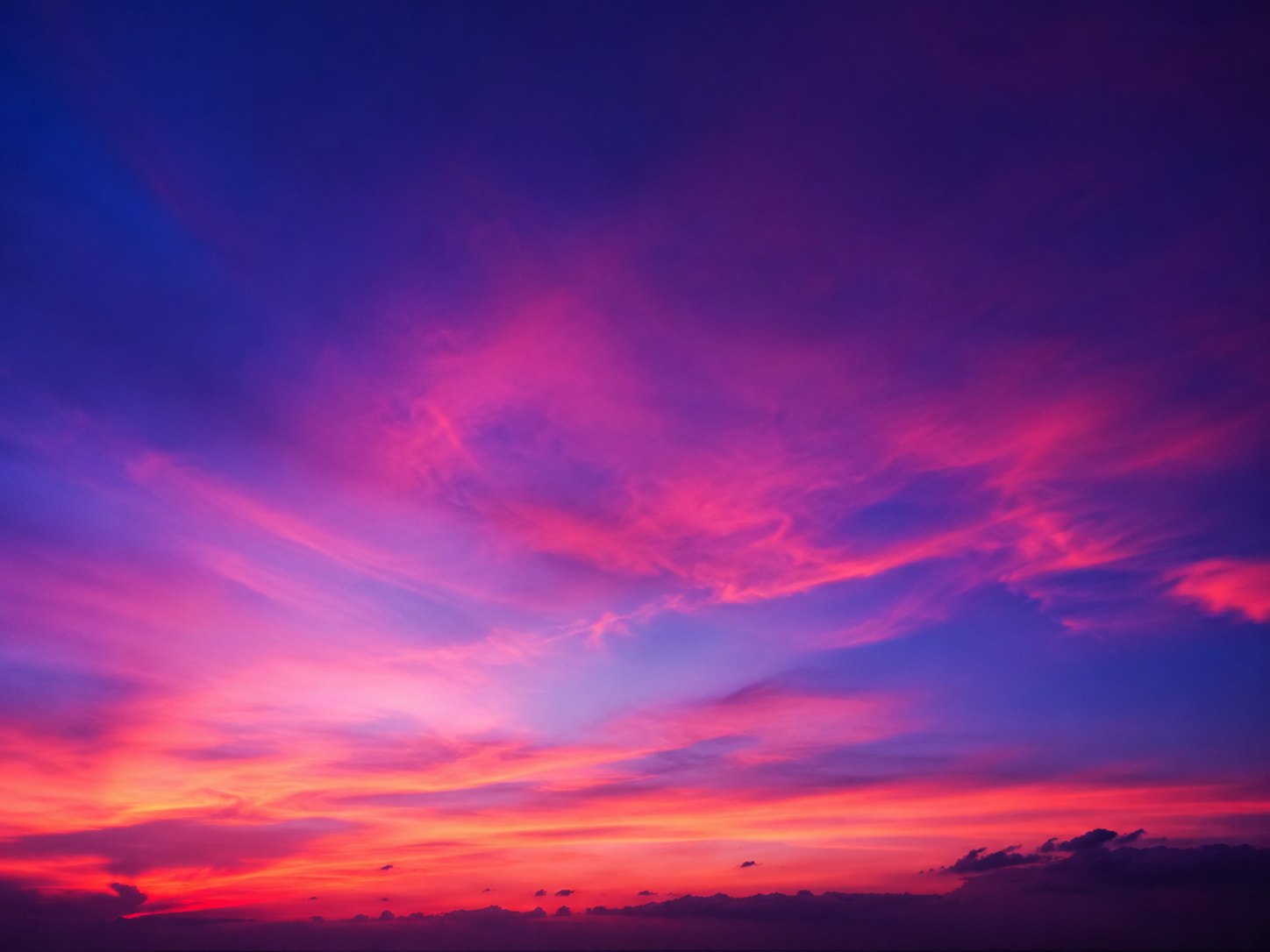 A vivid violet and pink sky after sunset