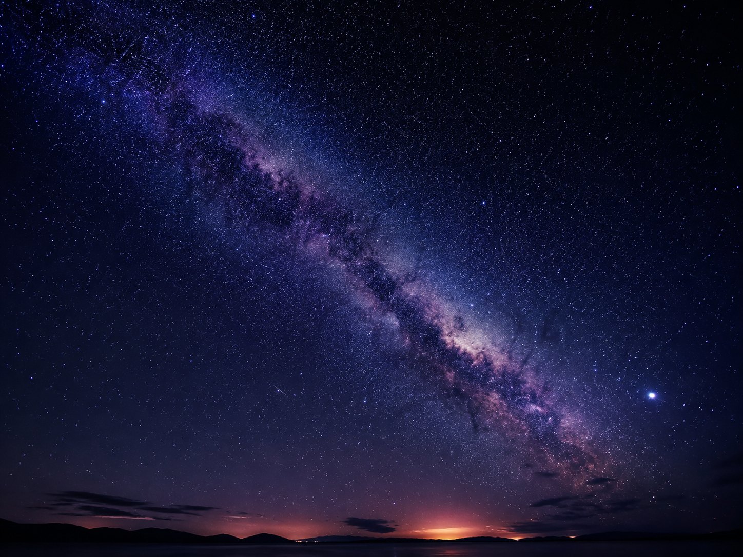 The Milky Way crossing a dark star-filled night sky